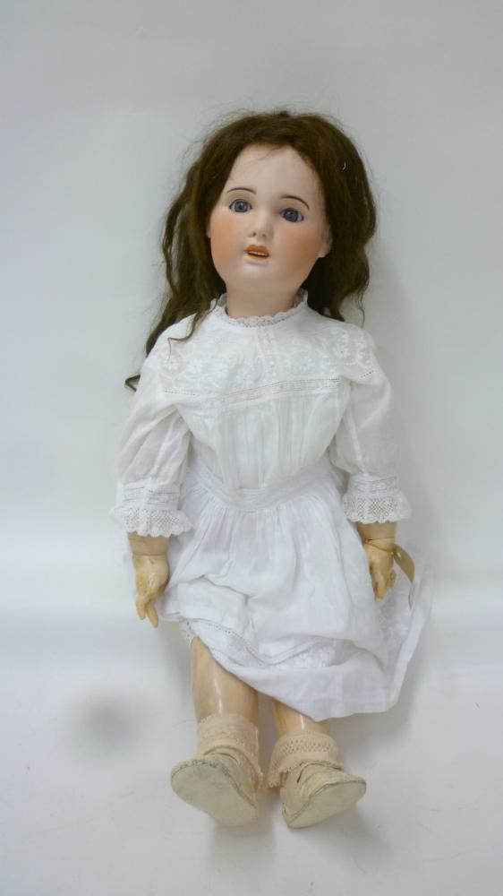 Dolls & Equipment. An S.F.B.J. Jumeau mould bisque head girl doll with blue glass sleeping eyes,