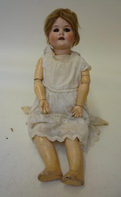 Dolls & Equipment. A Max Handwerck Bebe Elite bisque head girl doll with brown glass sleeping