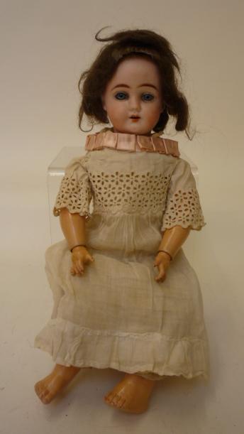 Dolls & Equipment. An Ernst Heubach bisque head girl doll with fixed blue glass eyes, open mouth and