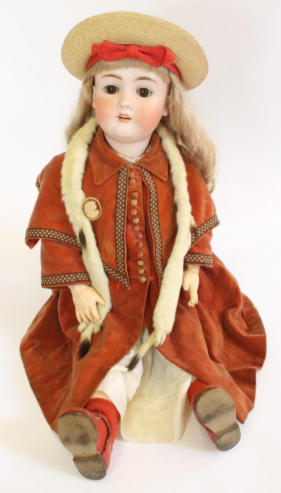 Dolls & Equipment. A large Kestner bisque head girl doll with brown glass sleeping eyes, open