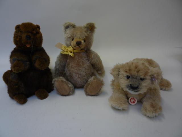 Teddies & Soft Toys. A Steiff replica bear, 14" high, a Steiff replica lion cub, 13" long, and a