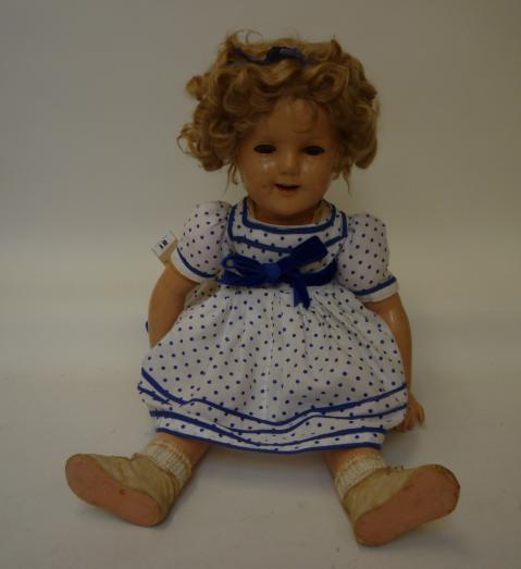 Dolls & Equipment. A Shirley Temple all composition doll, c.1938, with brown glass sleeping eyes,