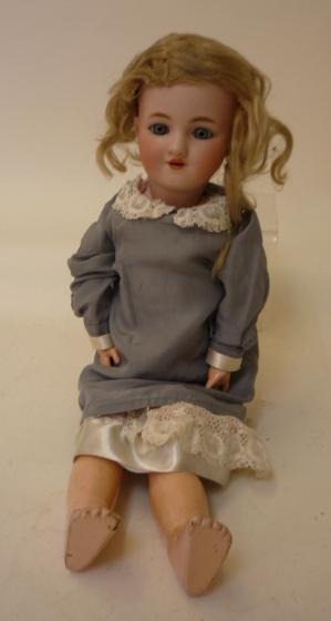 Dolls & Equipment. A Simon & Halbig for Louis Lindner & Sohne bisque head girl doll with blue