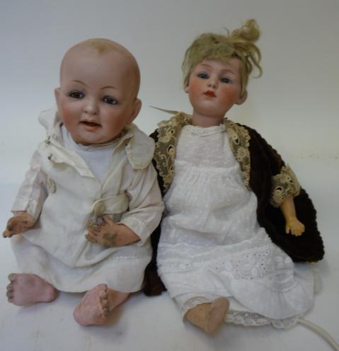 Dolls & Equipment. A Gebruder Heubach bisque head doll with fixed blue glass eyes, closed mouth,