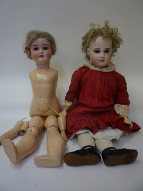 Dolls & Equipment. A Kley & Hahn bisque head doll with brown glass sleeping eyes, open mouth and