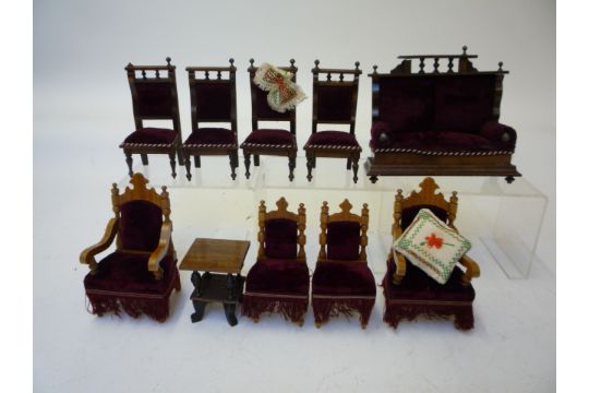 Dolls & Equipment. A suite of carved wood and red velvet upholstered dolls house furniture