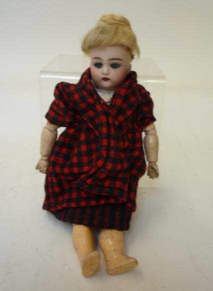 Dolls & Equipment. A Kammer & Reinhardt bisque head girl doll with blue glass sleeping eyes, open