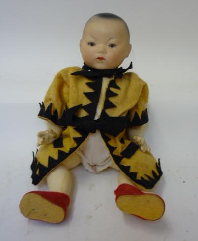 Dolls & Equipment. An Armand Marseille bisque head Chinese baby doll with brown glass sleeping eyes,