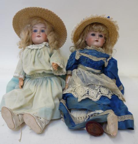 Dolls & Equipment. An Ernst Metzler bisque head girl doll with blue glass sleeping eyes, open