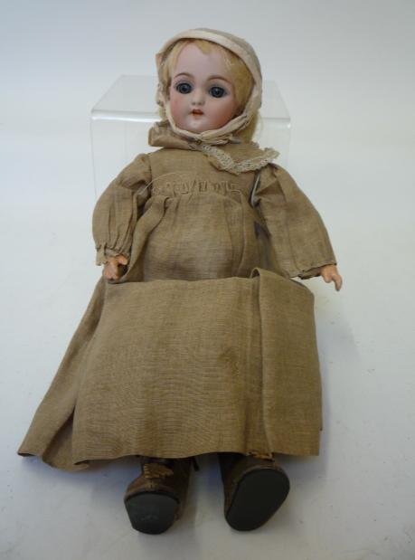 Dolls & Equipment. A Simon & Halbig bisque head girl doll with blue glass sleeping eyes, open