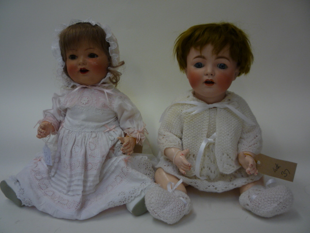 Dolls & Equipment. A British composition girl doll, c.1930, with brown glass sleeping eyes, open