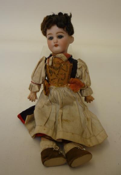 Dolls & Equipment. A Simon & Halbig bisque head girl doll with blue glass sleeping eyes, closed