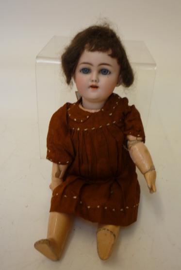 Dolls & Equipment. A Simon & Halbig bisque head girl doll with blue glass sleeping eyes, open