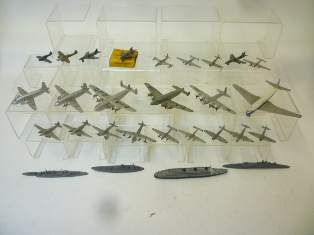 Diecast Vehicles. Twenty three Dinky aircraft models, P-F, and a quantity of Dinky ships (poor)