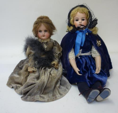 Dolls & Equipment. An Armand Marseille bisque shoulder head doll with fixed brown glass eyes, open