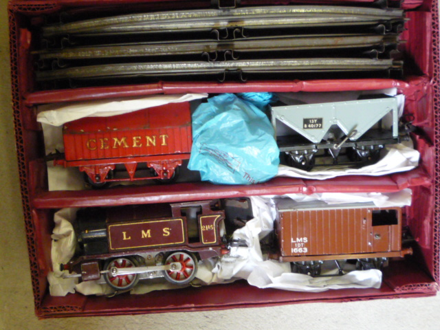 Model Railways. Hornby electric No 1 0-4-0 L.M.S. tank locomotive 2115, three goods trucks and three