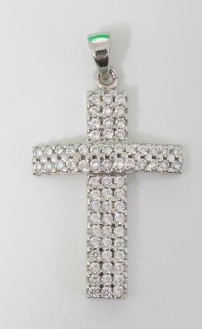 A DIAMOND SET CROSS PENDANT of slightly concave form, the numerous stones pave set in 18ct white