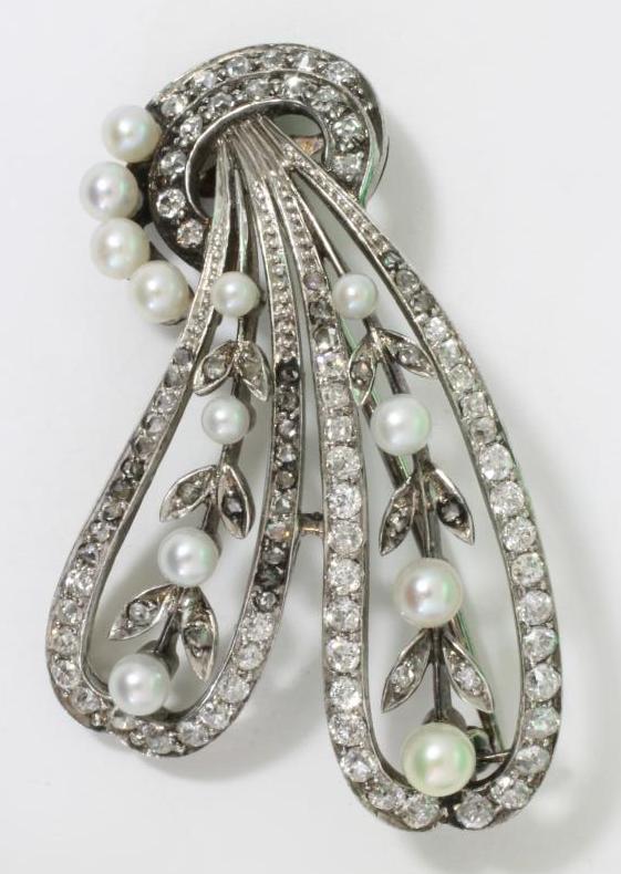 A VICTORIAN DIAMOND AND PEARL SPRAY BROOCH, the two loops millegrain set with numerous small