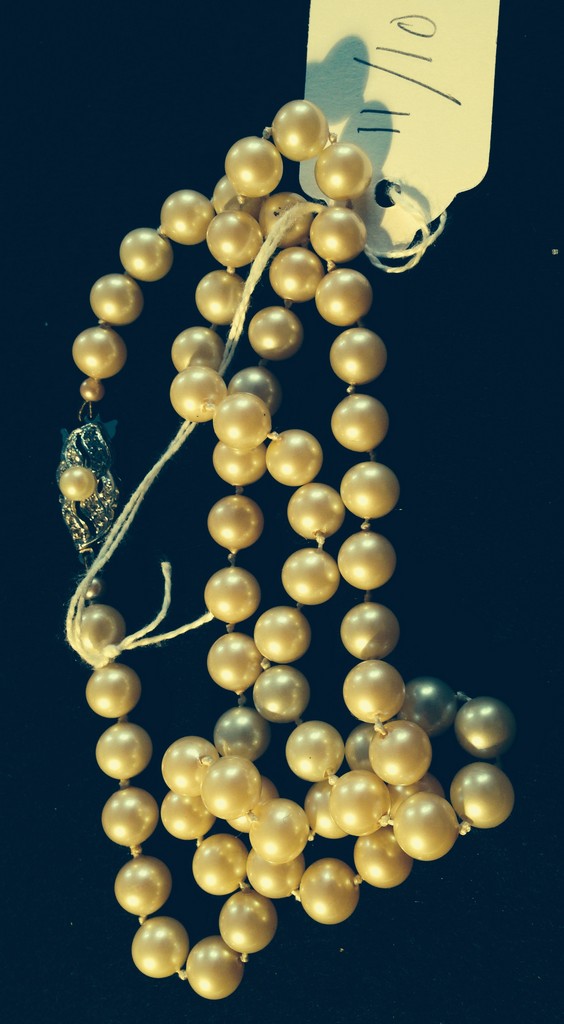 String of pearls with silver clasp.
