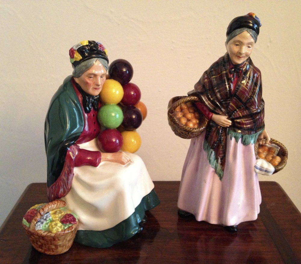 Two Royal Doulton figures, The orange Lady HN1759 and The Old Balloon Seller HN1315.