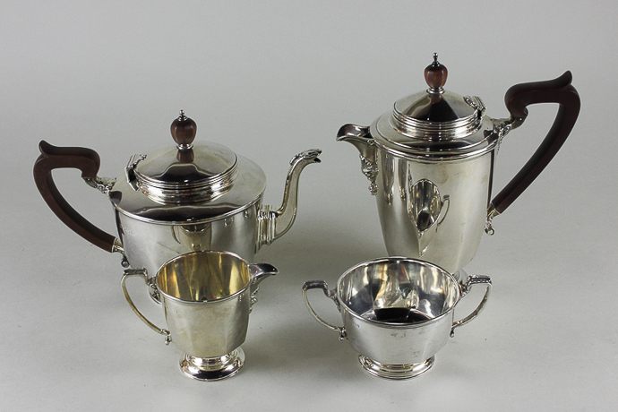 A four piece silver tea set, maker N G Co Birmingham 1929/20/31, with circular bodies on stemmed