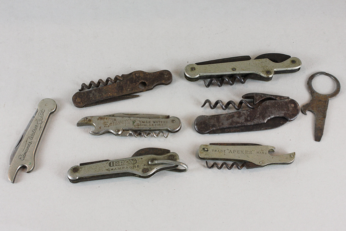 A collection of eight corkscrews and bottle openers