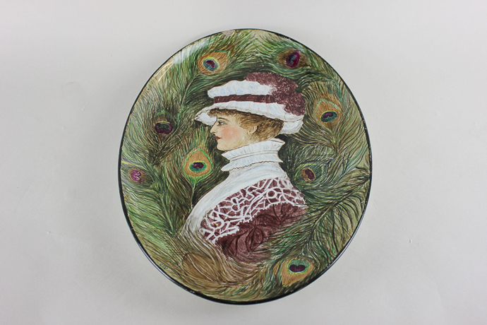 A French Montereau oval porcelain dish decorated with the profile of a lady amongst peacock