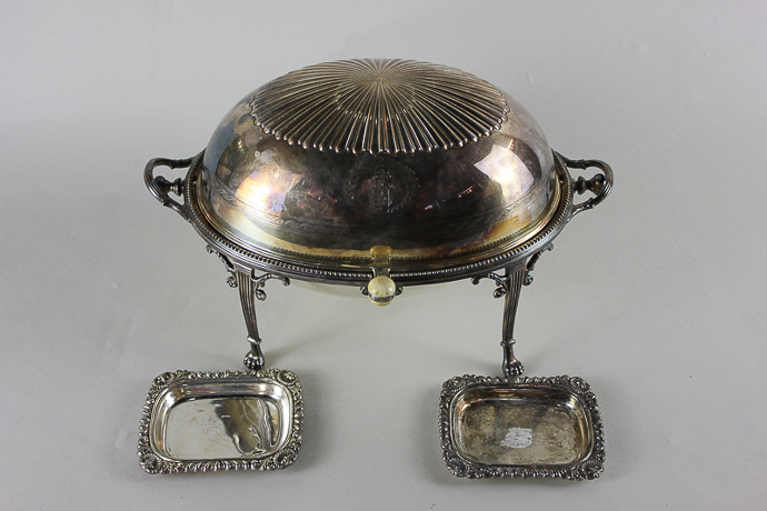 A plated revolving breakfast dish with liners on four paw feet (crested), together with two small