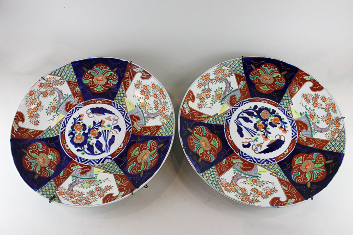 A pair of large Japanese Imari porcelain chargers with decorative sections and floral centre, 46cm,