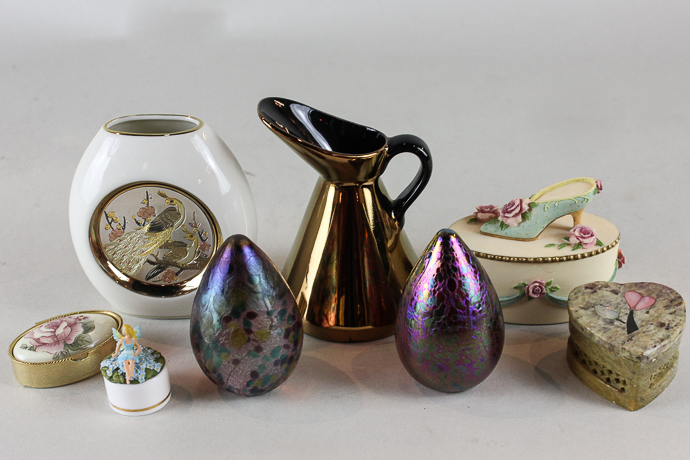 A pair of Isle of Wight glass egg shaped paperweights together with a small assortment of trinket