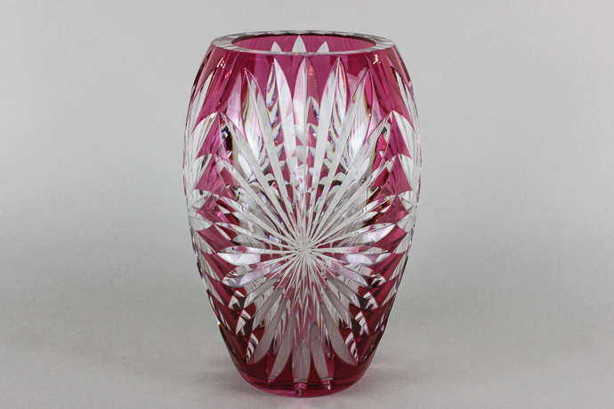 A Val St Lambert heavy overlaid cranberry and clear glass vase with slice cut decoration, 24cm high,