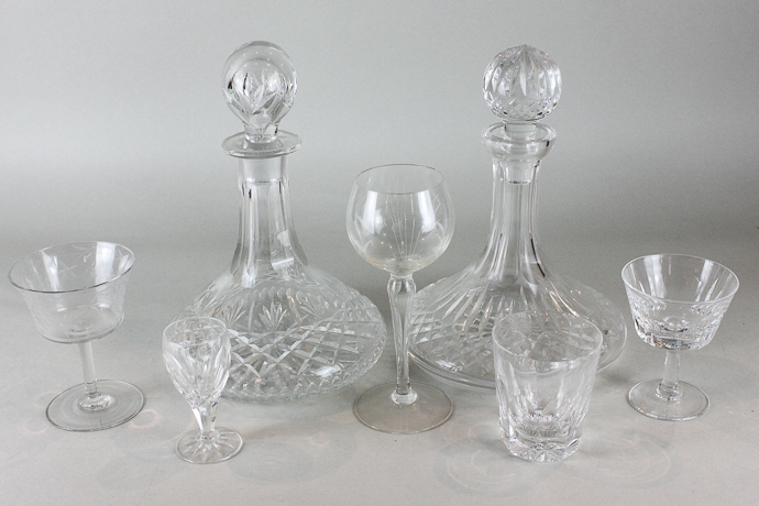 A set of fourteen champagne glasses with decorated bowls, eight stemmed hock glasses, six