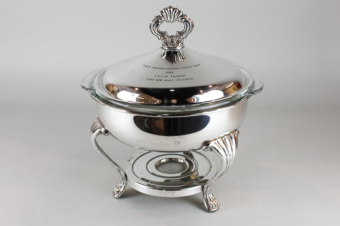 A plated circular dish with liner on stand inscribed A.W.A Sidney Hobart Yacht Race 1984 C.Y.C.A.