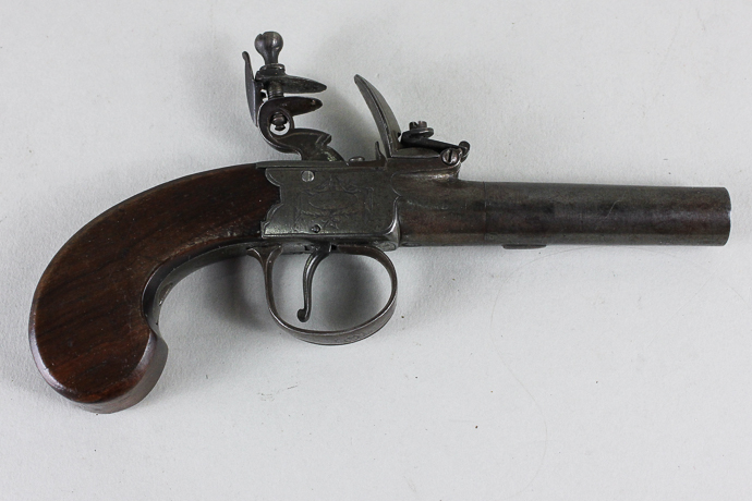 An early 19th century flintlock pistol by Higham of London, with signed lockplate and walnut grip,