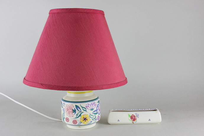 A Poole Pottery table lamp decorated with flowers and a small rectangular dish