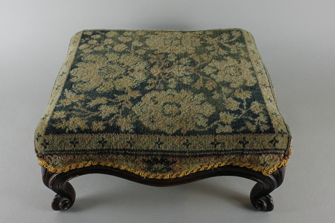 A tapestry topped square footstool on scroll feet, 38cm