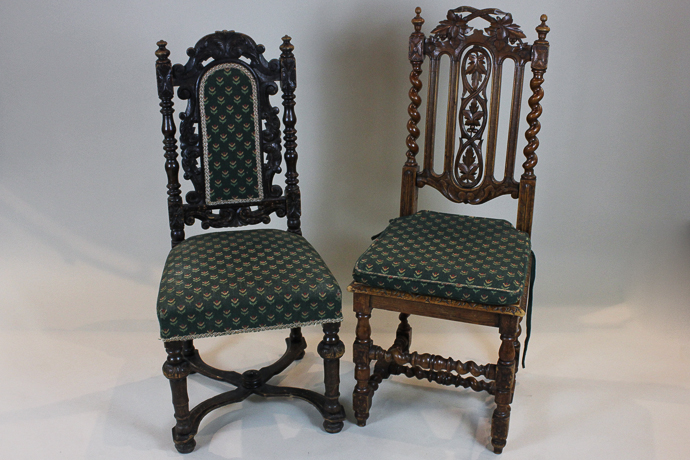A carved oak high back chair with solid seat and another with upholstered back panel,