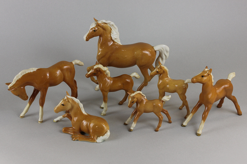 A Beswick Palomino Prancing Arab type H1261 together with six assorted foals all in Palomino gloss