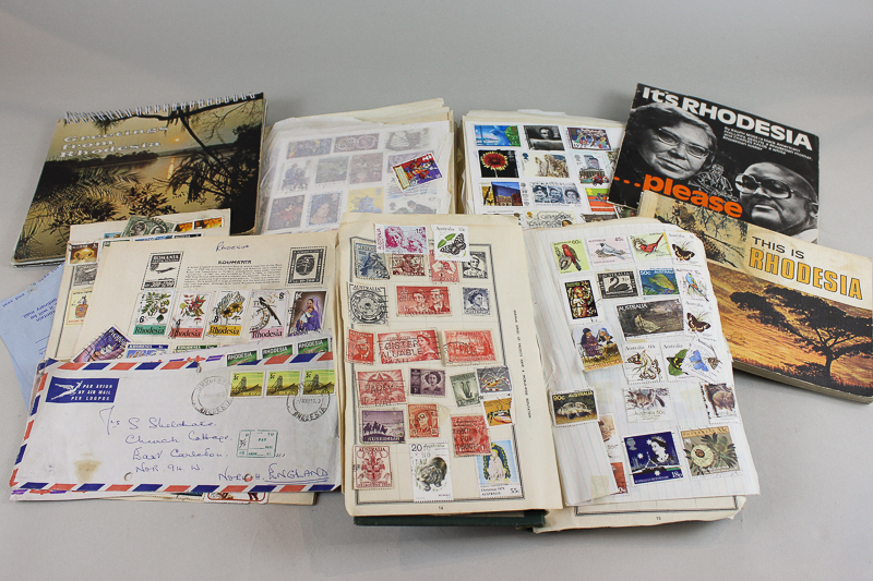 A Rhodesia and world stamps collection in various small albums and loose, a Rhodesia brochure,