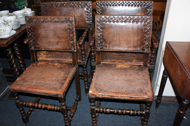 A set of six Cromwellian style dining chairs, (two carvers and four single) upholstered in brown