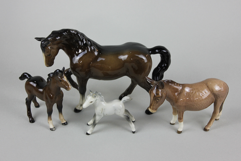 A Beswick Stocky Jogging Mare third version 1090 in brown gloss with a small grey foal stretched