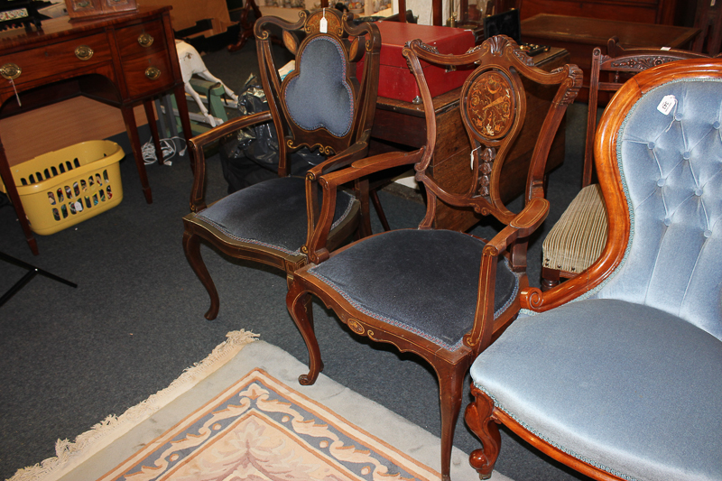 Two Edwardian drawing room elbow chairs with inlaid decorated backs on cabriole front legs and a