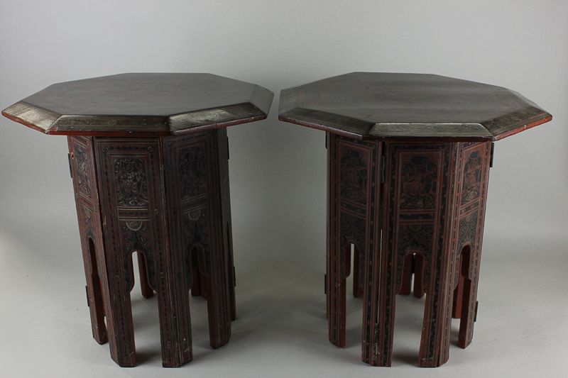 Two black and red lacquered occasional tables with octagonal tops on folding bases, 39cm