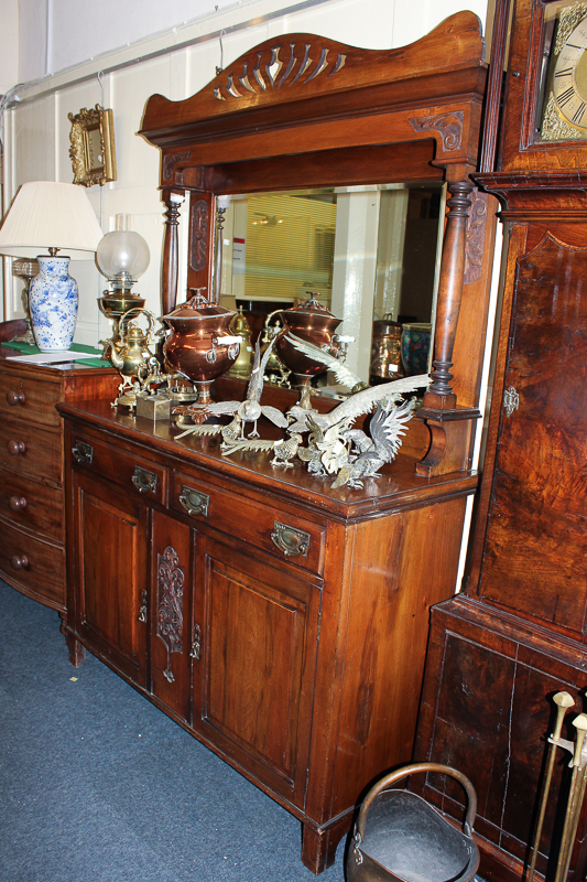A Victorian mahogany sideboard with raised mirror back and column supports above drawers and