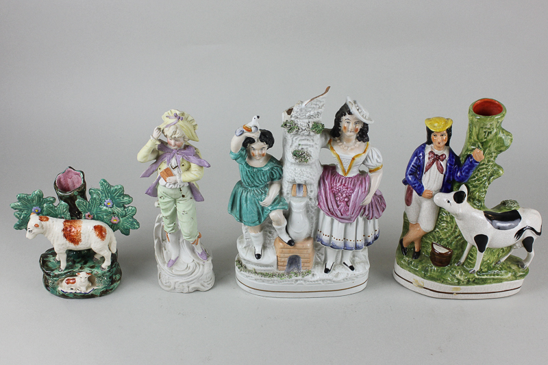 Three Staffordshire flat back ornamental taper holders, mother and child, sheep, farmer and cow, and