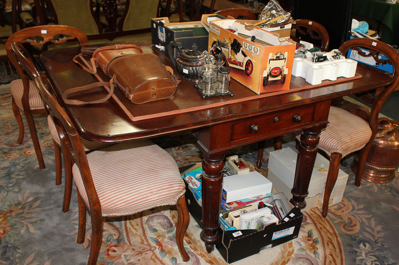 A Victorian mahogany Pembroke dining table with two end drawers, on turned legs and casters, extends