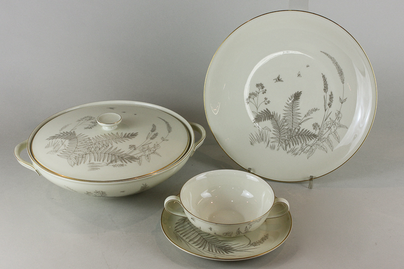 A German porcelain part dinner service Heinrich Ivory Body Supreme with gilt fern decoration,