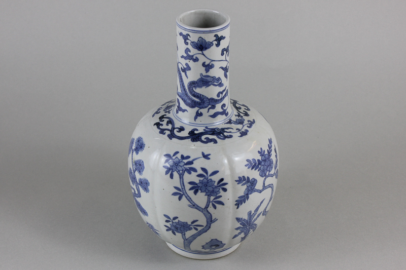 A Chinese porcelain blue and white vase with globular body and tapered neck, decorated with dragon