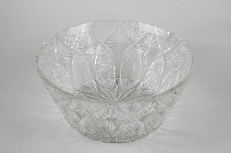 A cut glass circular bowl with arch, star and hobnail decoration, 26cm diameter