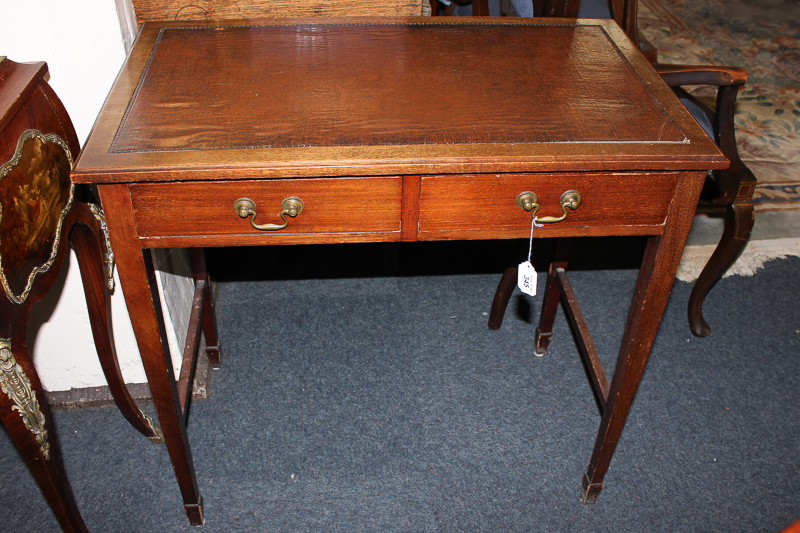 A small Edwardian writing table with two drawers on square tapered legs, 76cm